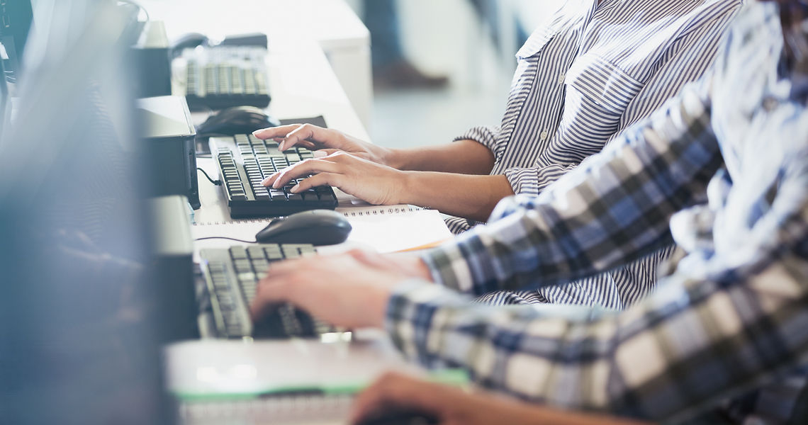 Students Typing at Their Computer