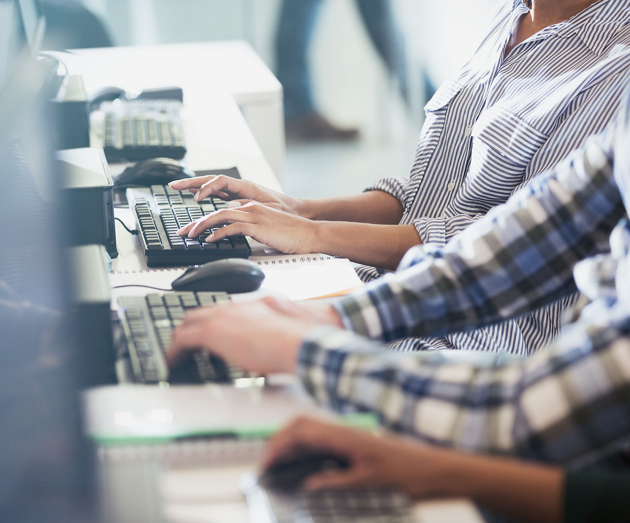 Managed IT Services, People typing on their keyboards