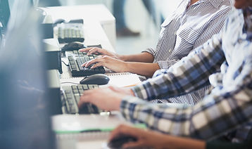 Students Typing at Their Computers