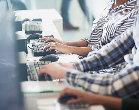 Students Typing at Their Computer