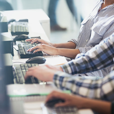 Students Typing at Their Computer