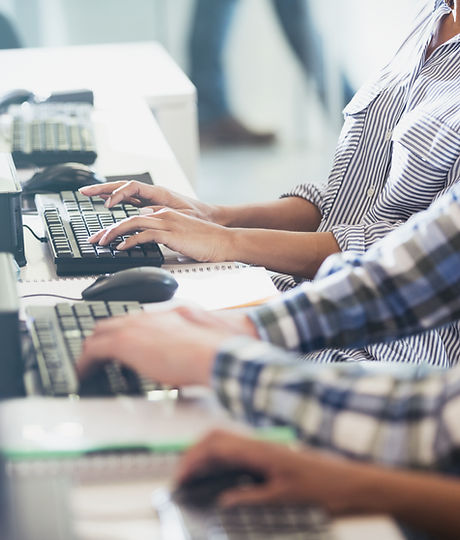 Students Typing at Their Computer