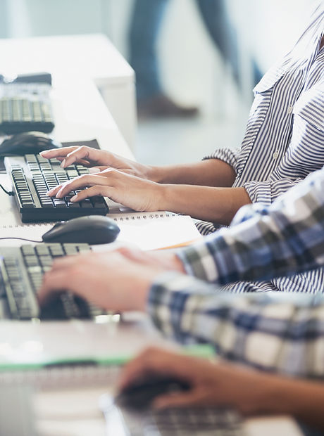 Students Typing at Their Computer