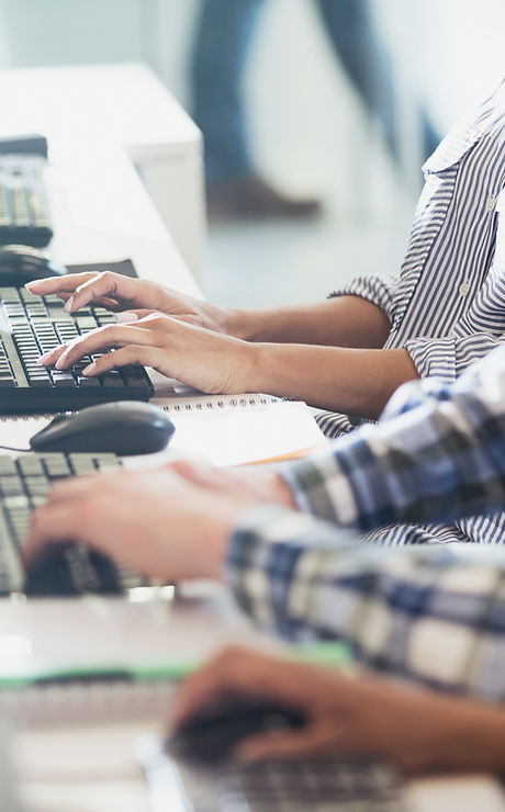 Students Typing at Their Computer