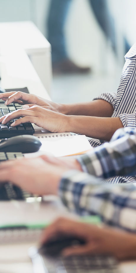 Students Typing at Their Computer