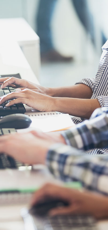 Students Typing at Their Computer