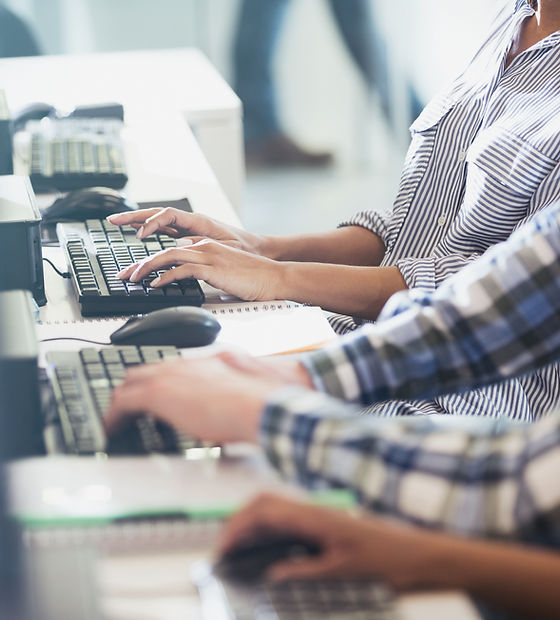 Students Typing at Their Computer