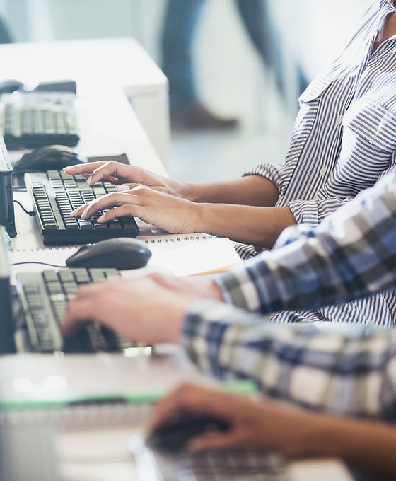 Students Typing at Their Computers