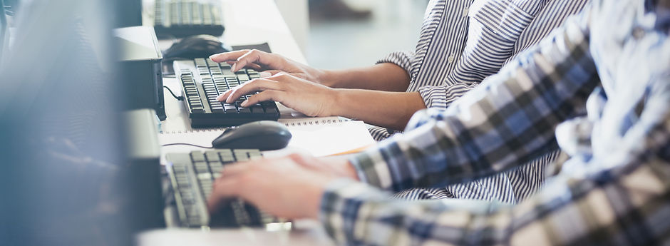 Students Typing at Their Computer