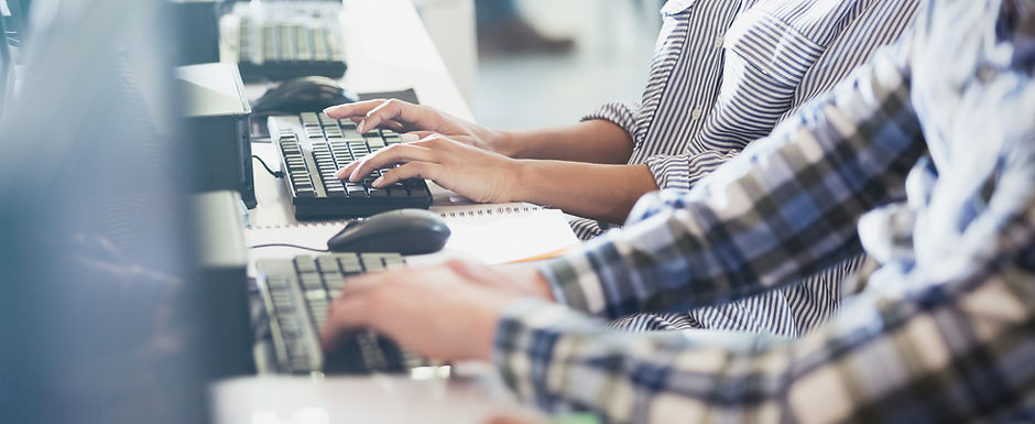 Students Typing at Their Computer