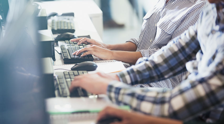 Students Typing at Their Computers