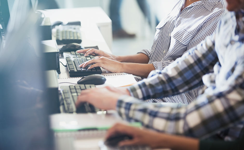 Students Typing at Their Computers