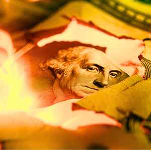 Burning US Dollar Bill symbolizing Extractive Economy and Economic Collapse