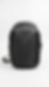 Black minimalist tech backpack with a smooth matte nylon finish and streamlined aerodynamic design.
