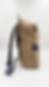 Zenith Nomad khaki utility backpack with navy accents and multi-pocket design for tech organization.