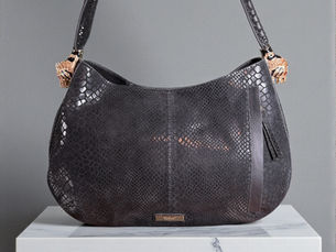 Black leather shoulder bag with tiger details on side