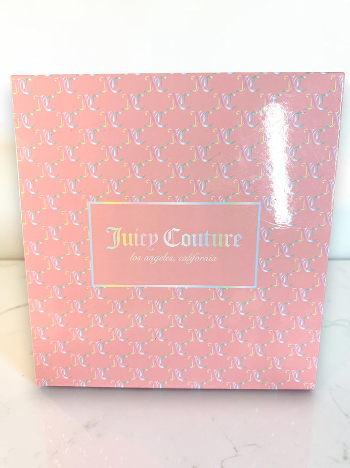 Original pink Juicy Couture presentation gift box with repeating JC logo pattern