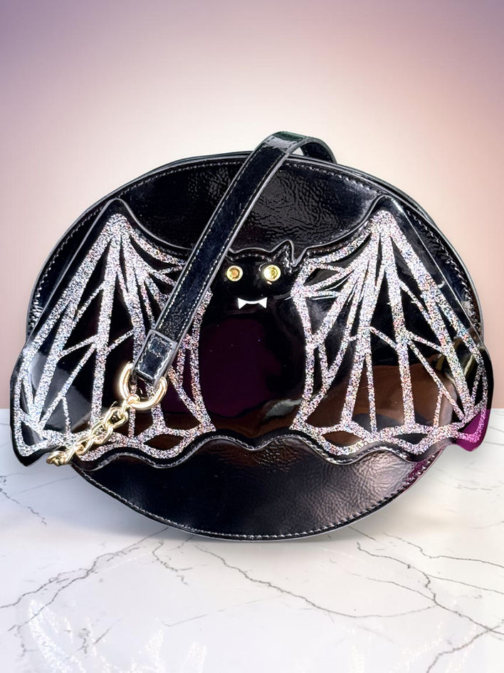 Betsey Johnson Bat Kitsch black crossbody with silver glitter wings and gold-tone chain