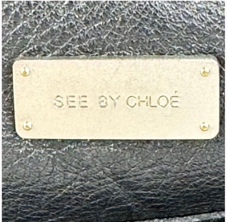 See by Chloé metal logo badge on black leather detail