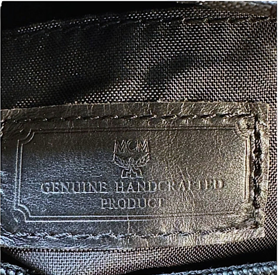 Close-up of vintage MCM genuine leather interior tag