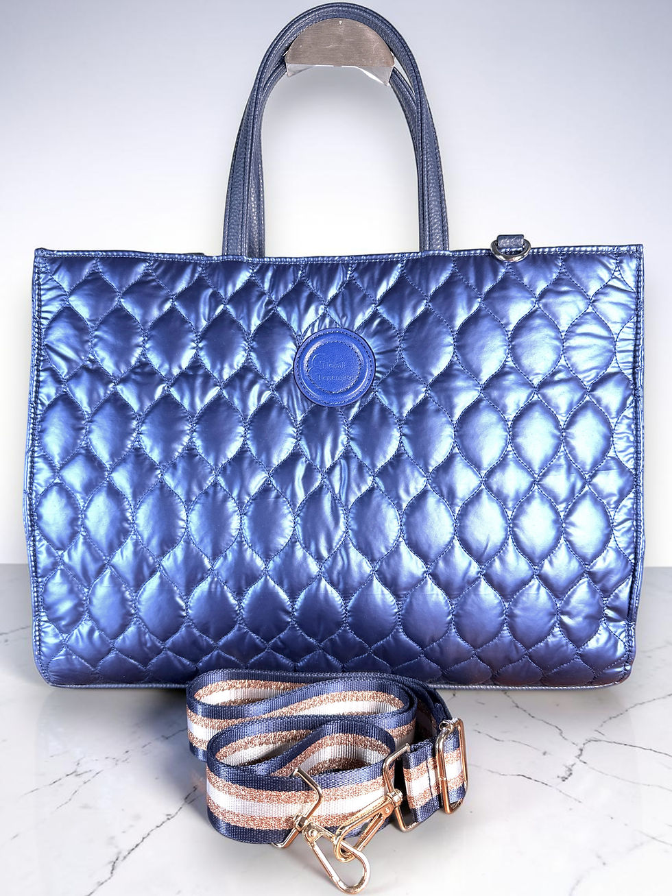 Sharif Global Generation Metallic Sapphire Blue quilted puffer sample tote with included striped crossbody strap