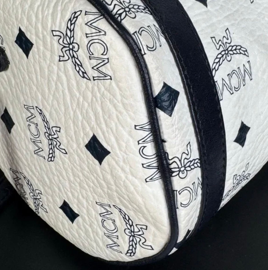 MCM Papillon Crossbody rounded barrel side showing navy leather details