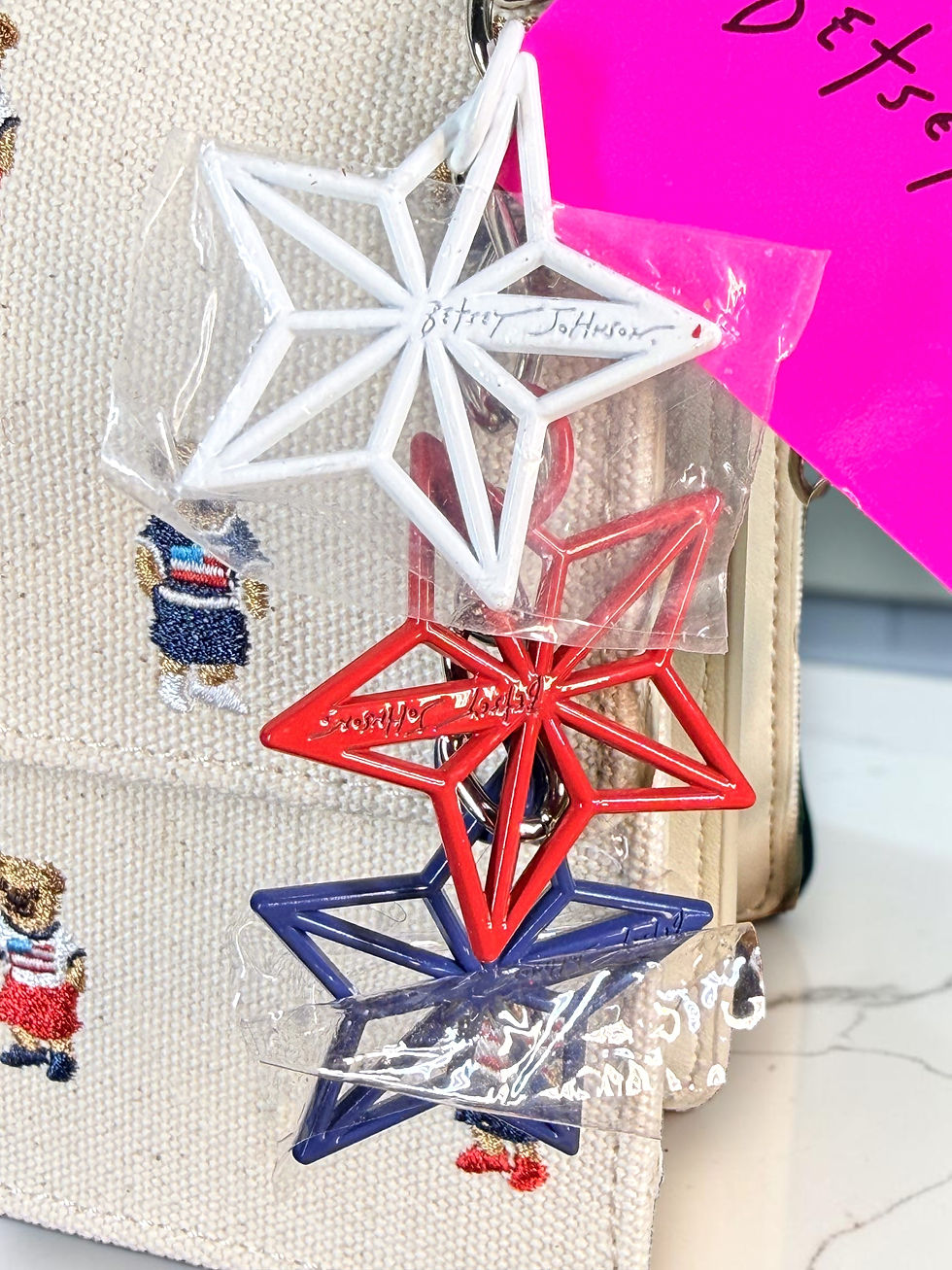 Betsey Johnson red, white and blue star charms in protective wrapping.
