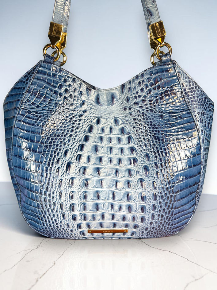Brahmin Marianna glossy blue croc-embossed leather front detail.