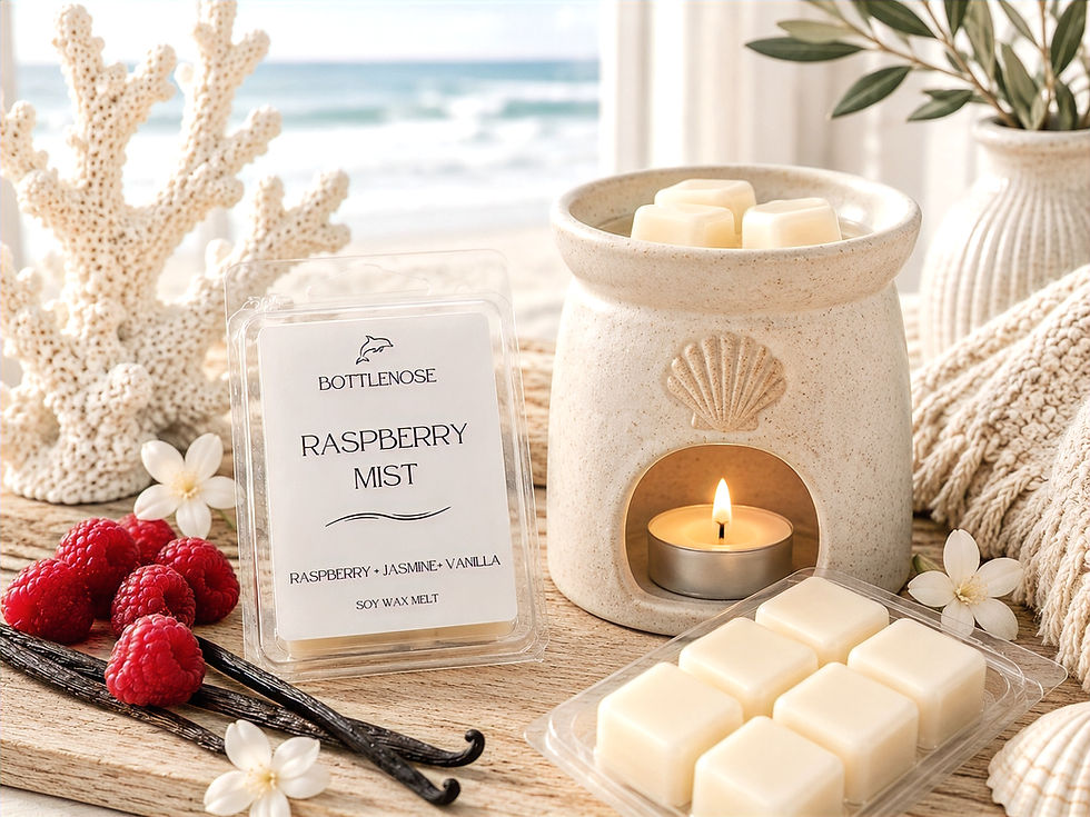 Raspberry Mist wax melt cubes beside an electric wax warmer