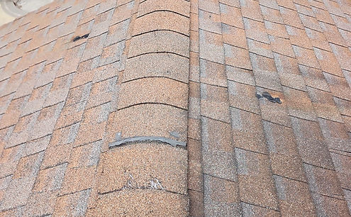 Worn asphalt shingle roof