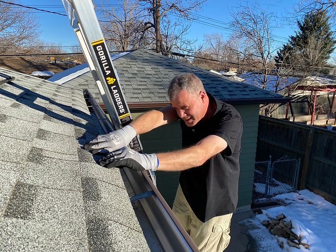Dehn working on a roof.