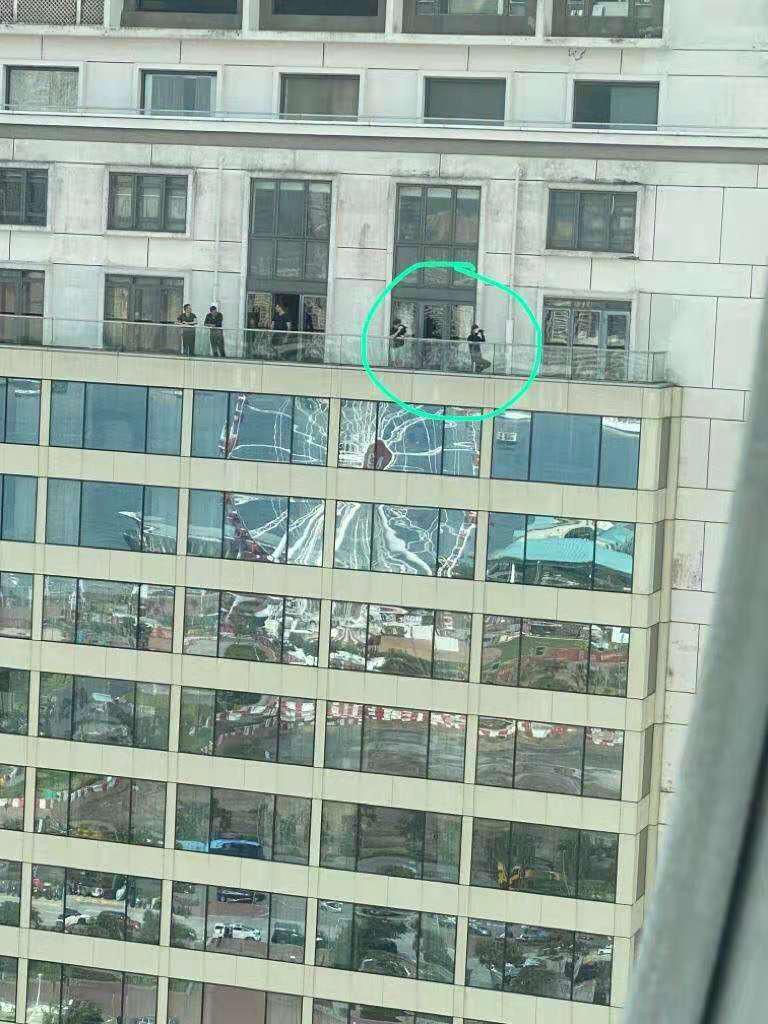 Fig.6 PHOTO FILE: It shows black shirted rioters are at the balcony of the presidential room of Mandarin Oriental Hotel. Image: Internets