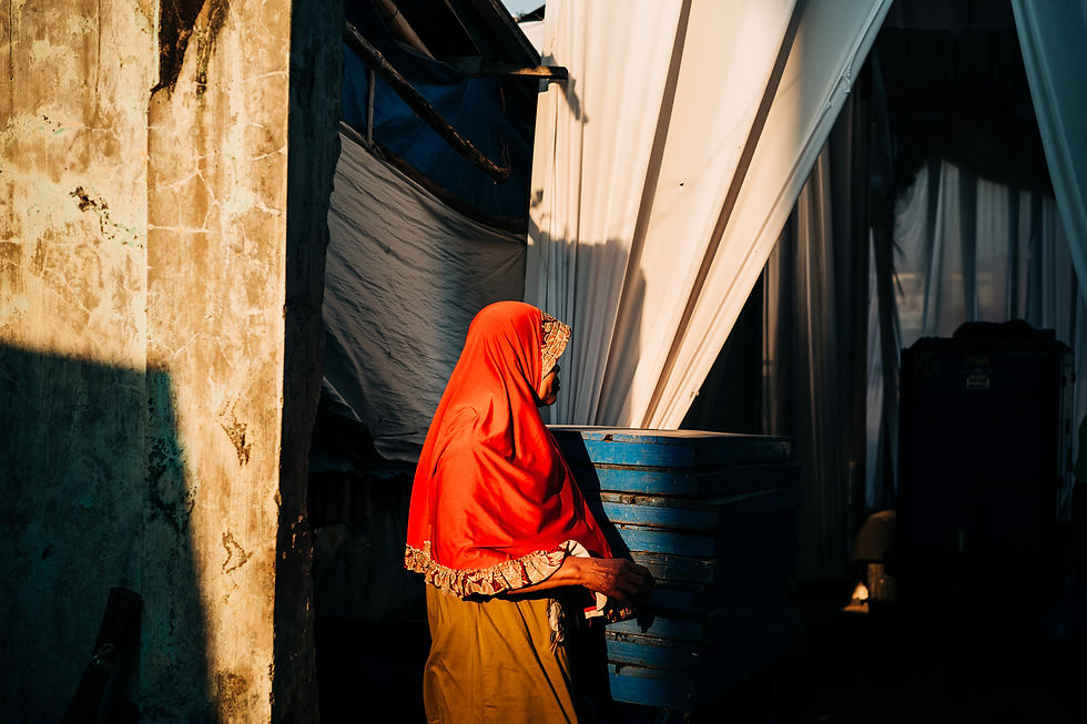 Muslim women highlighted by the setting sun in Indonesia