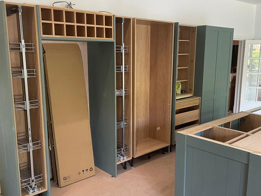 Painted bespoke kitchen cabinetry being fitted in a Yorkshire home