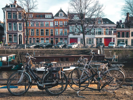 bicycles parked next to a canal in Groningen, Netherlands