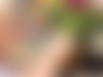 Little girl looking at vase of flowers recognizing the beauty-capturing the beauty of slowing down and capturing life's moments.