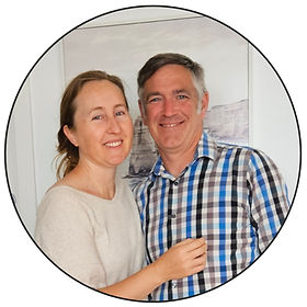 Nice friendly photo of Ember Migration owners Eric and Alyssia together in front of a white background