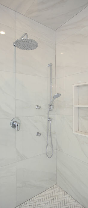 glass-shower-with-large-marble-tile-and-in-wall-built-in-shelf