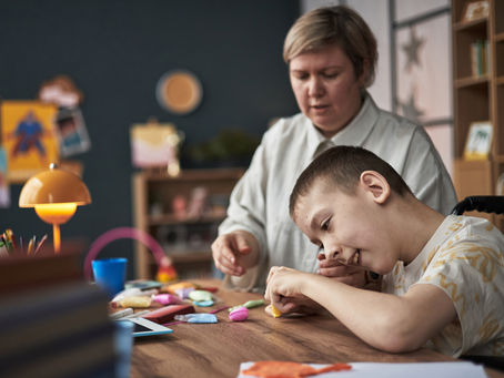adult-woman-and-child-engaged-in-craft-activity