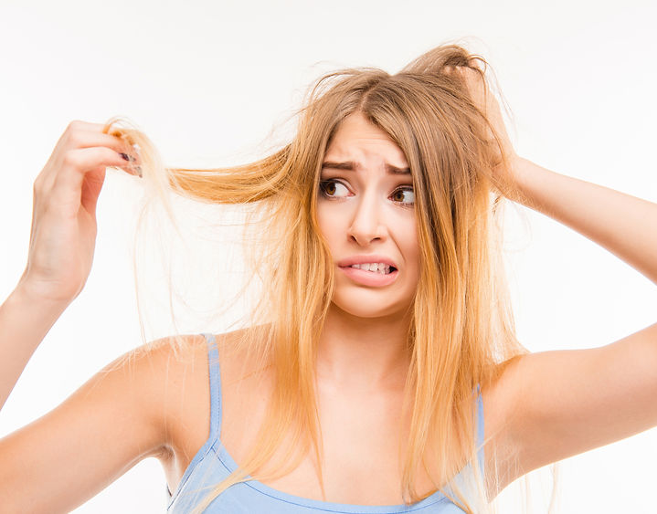 girl looking at hair.jpg
