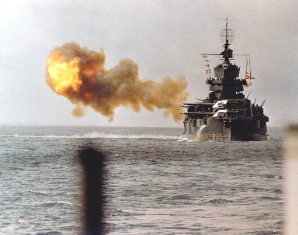 Navy description: “USS Idaho (BB-42) Bombarding Okinawa with her 14/50 main battery guns, 1 April 1945. Photographed from USS West Virginia (BB-48).”