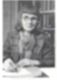A photo Caryll Houselander at her desk