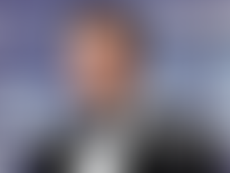 Elon Musk on the red carpet in a tuxedo, used as the cover image for his hair transplant transformation blog.