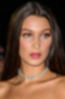 Bella Hadid close-up look after surgery showing enhanced lips and sculpted face.