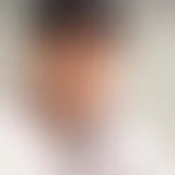 Freddie Freeman smiling in Braves uniform before dental work, showing natural teeth with mild misalignment