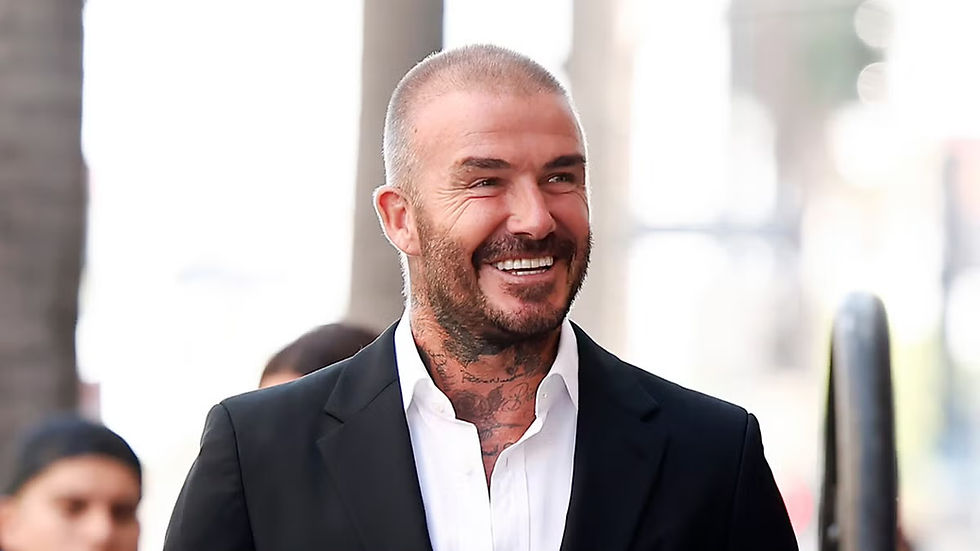 David Beckham with sharp hairline after possible restoration treatment, smiling in public.
