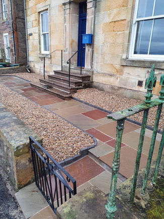 Coastal retreat after build, showing new paving and neat gravel.
