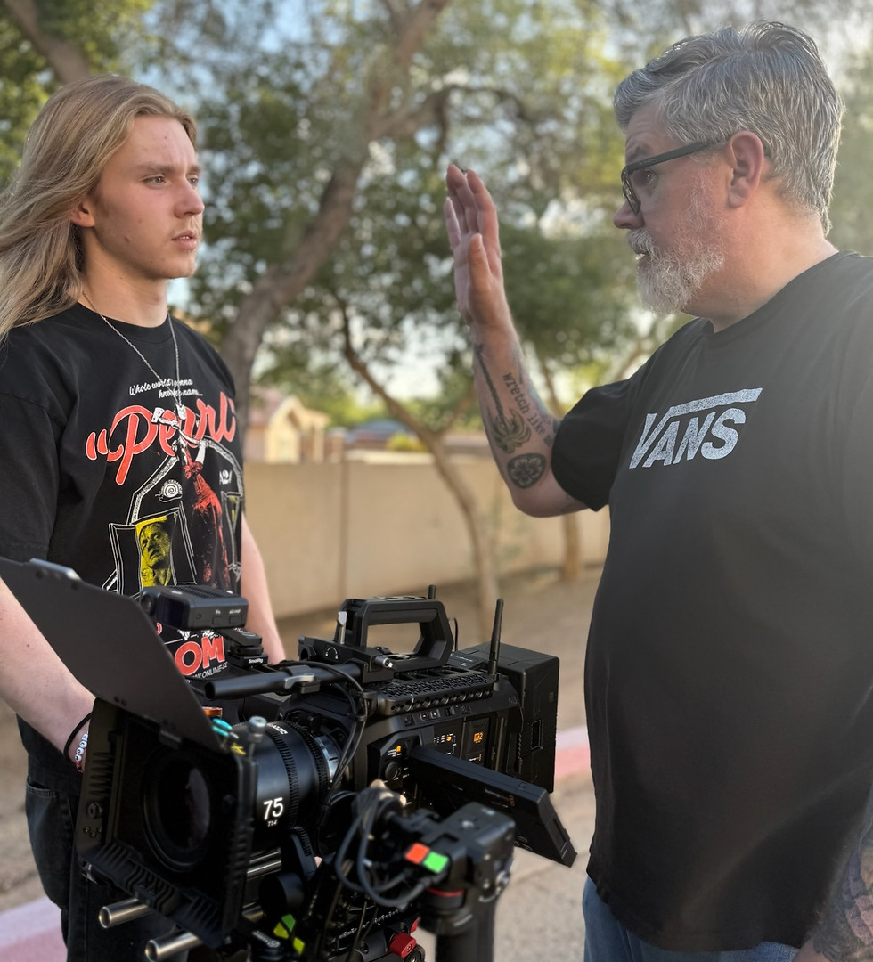 Father and son in the process of directing a movie
