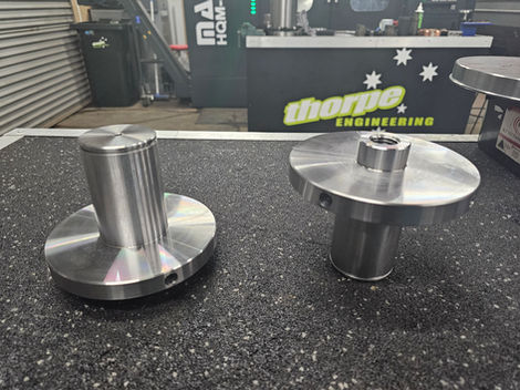 Two precision metal components display