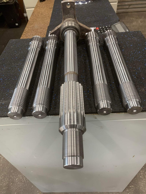 Metal shafts on a table Metal Components Display Engineering Cnc Mach
